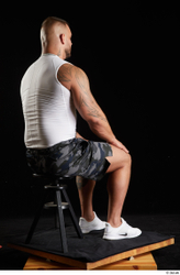 Whole Body Man White Sports Shorts Muscular Sitting Top Studio photo references